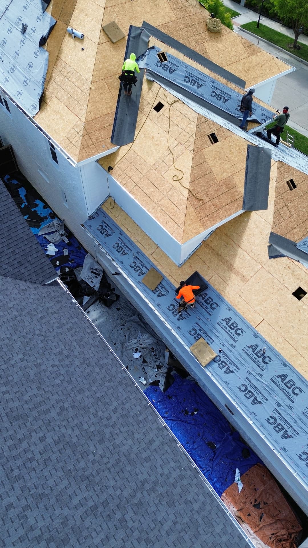 Yearby roof replacement in progress, aerial view 7: exposed decking and roofing underlayment